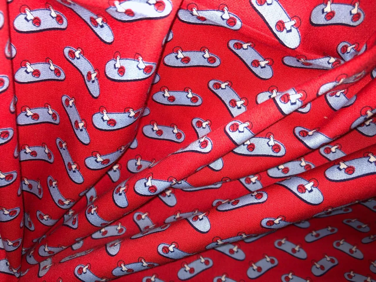 100% Cotton Poplin  Beach Prints 58" wide available in 4 prints bright orange flowers, / bird ,red with blue skates and the beach scene