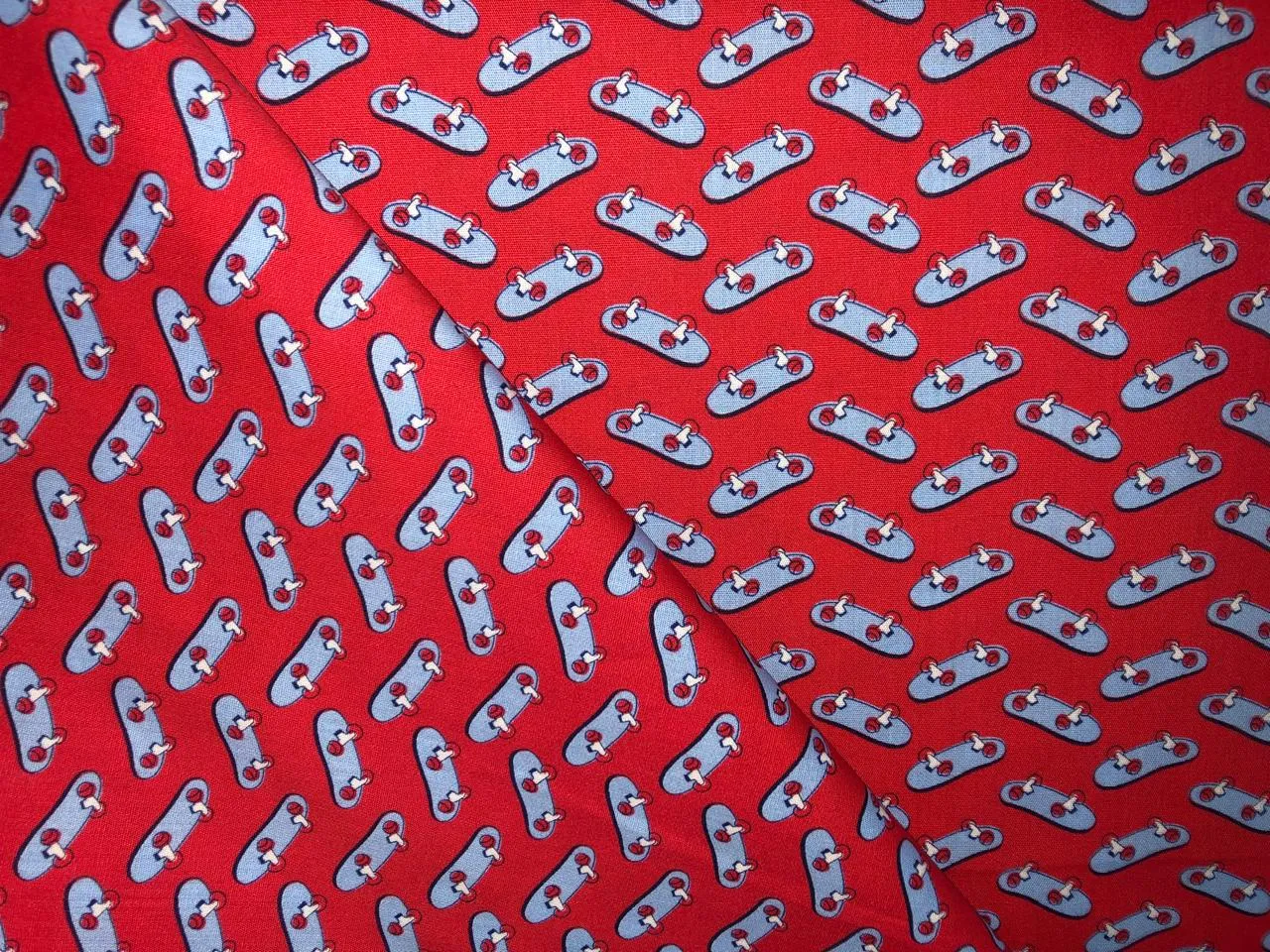 100% Cotton Poplin  Beach Prints 58" wide available in 4 prints bright orange flowers, / bird ,red with blue skates and the beach scene